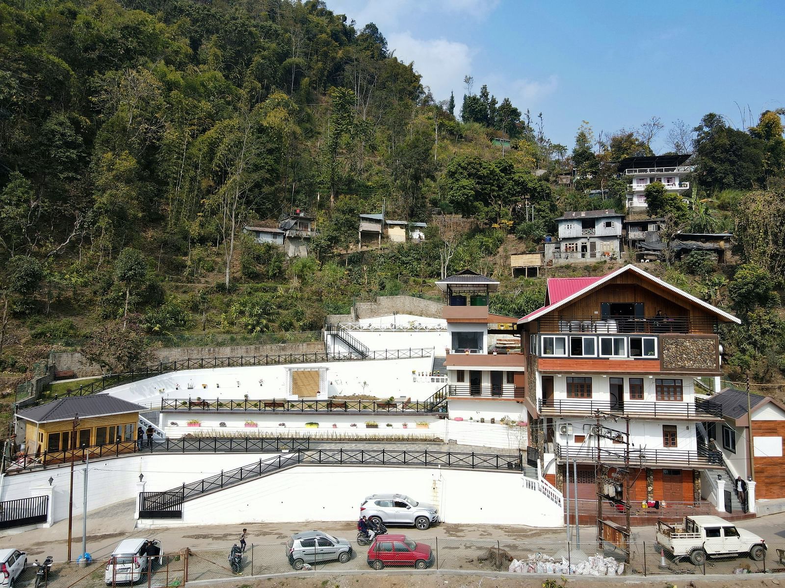 Facade of the hotel with parking space