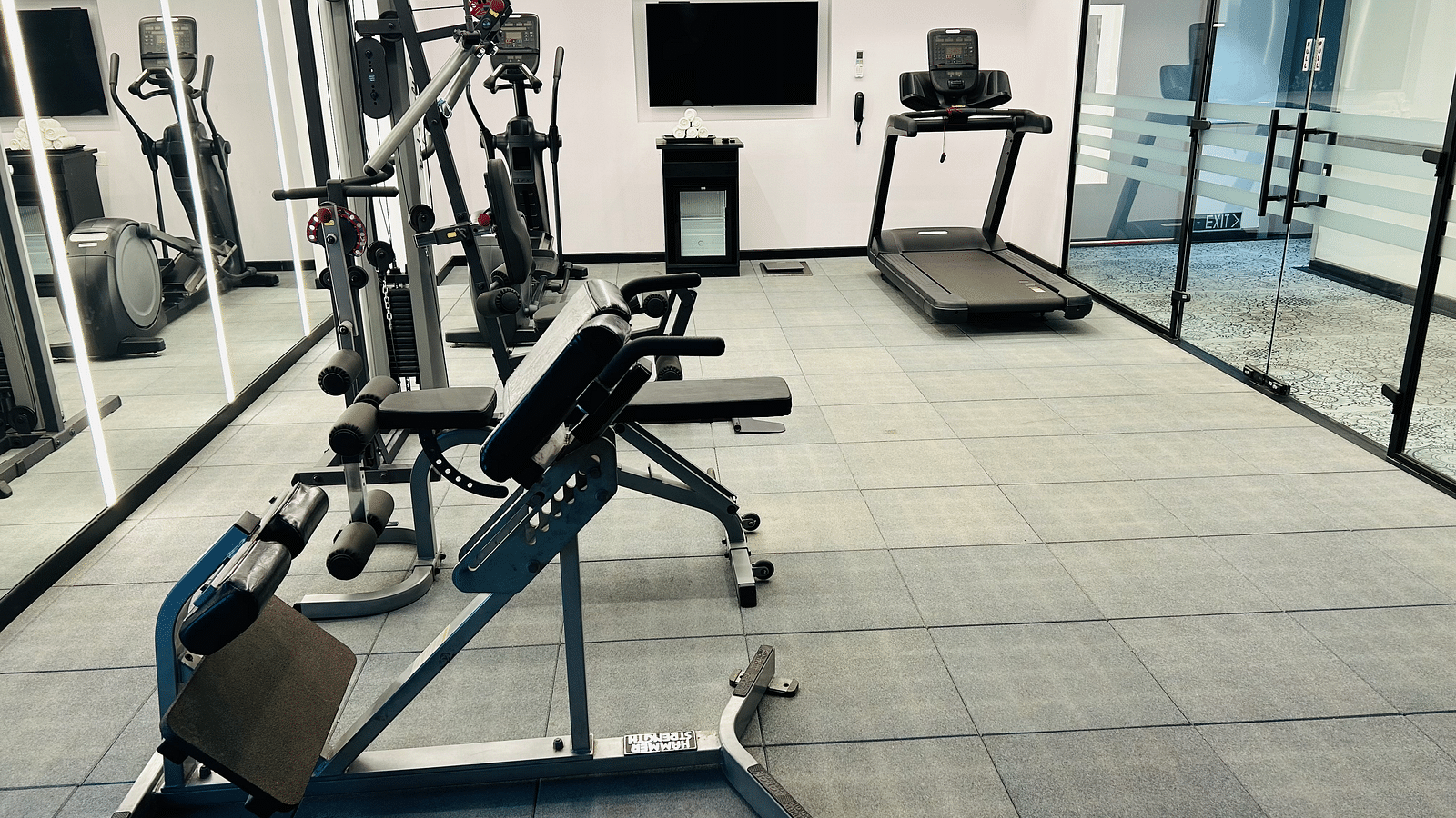 an image of a gym with workout equipment at Zibe Luxe Kakinada by GRT Hotels