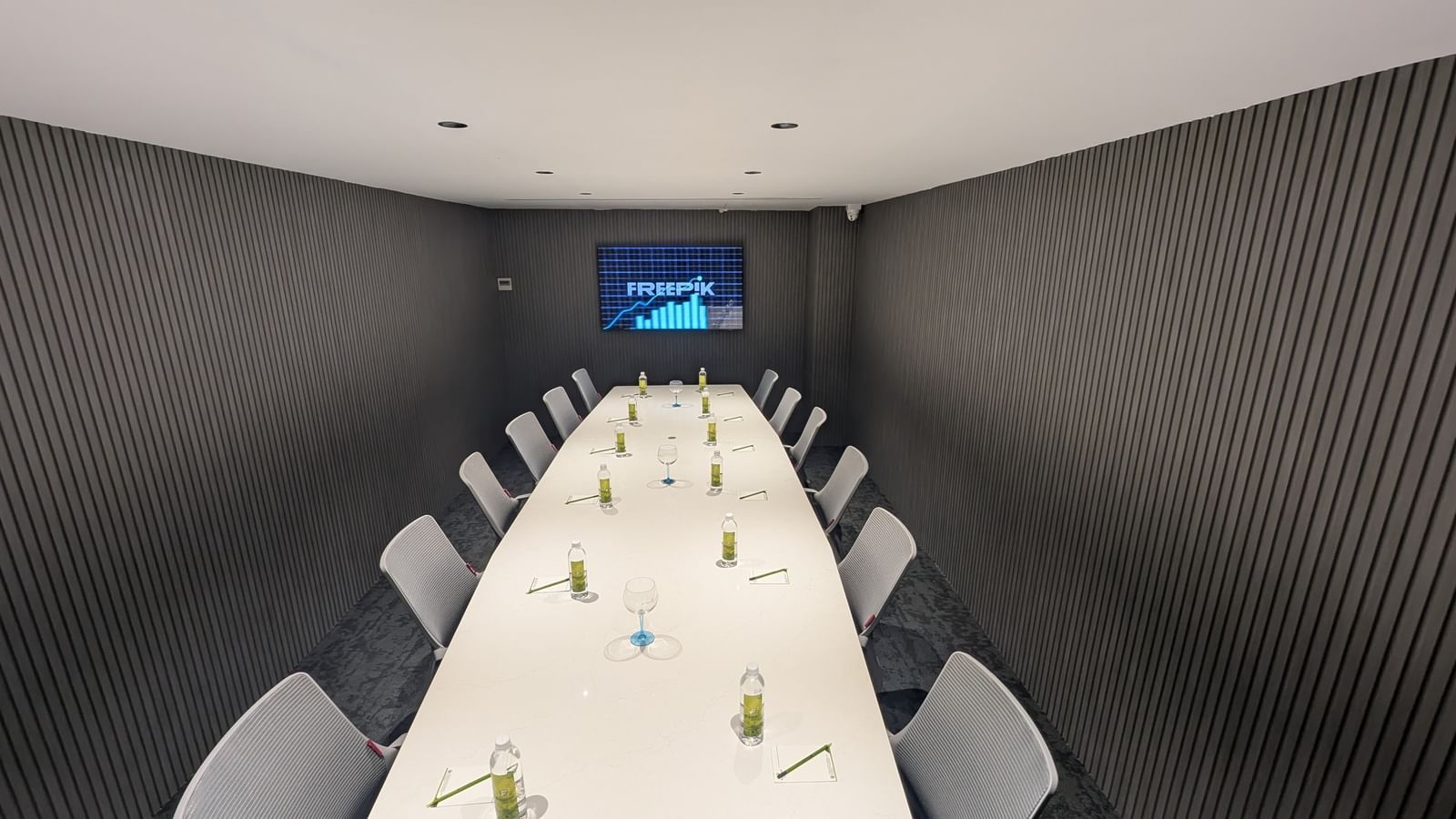 Long meeting table with TV screen at Fressotel, Kanakapura Road, Bangalore.