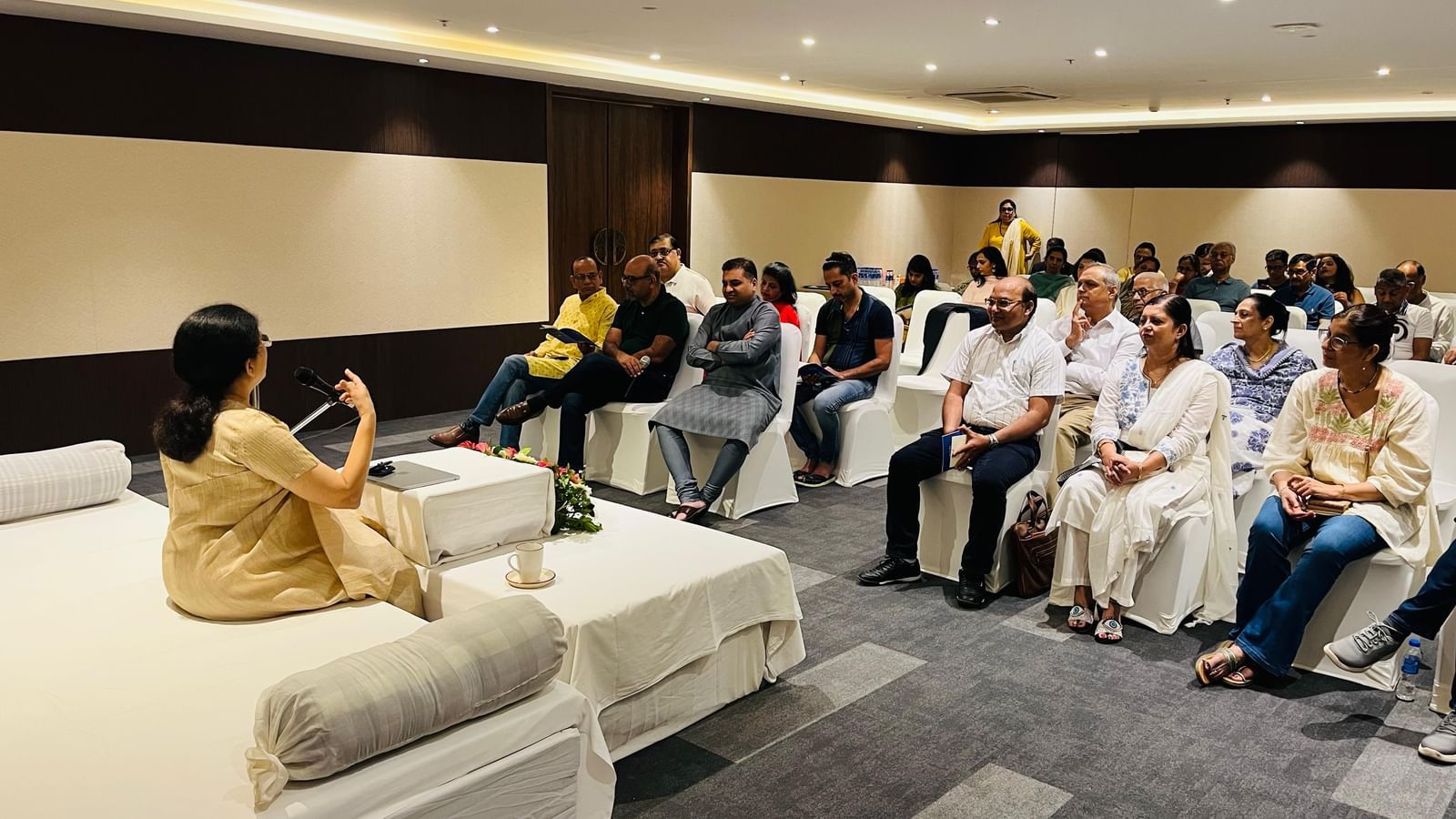 Guest speaker addressing an audience during a CSR initiative event at Rhythm Hospitality.