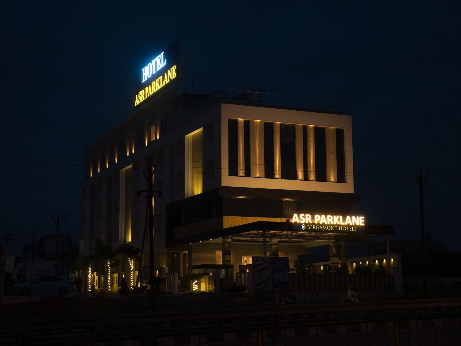  A far exterior view of the property building during the night time. 