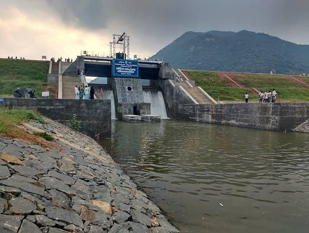 Overview of Viswakudi Dam surrounded by lush landscapes.