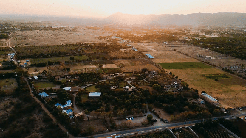 Aerial view of Clarks Safari Pushkar surrounded by greenery and expansive open spaces, offering a serene and spacious retreat in nature