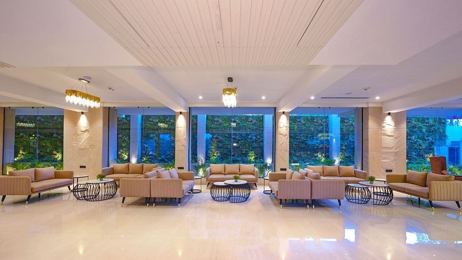 A lobby featuring sofas and tables - Royale Sarovar Portico, Agra