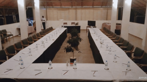 An overview of the banquet hall with seating arrangement in view at Abad Brookside Lakkidi, Wayanad.