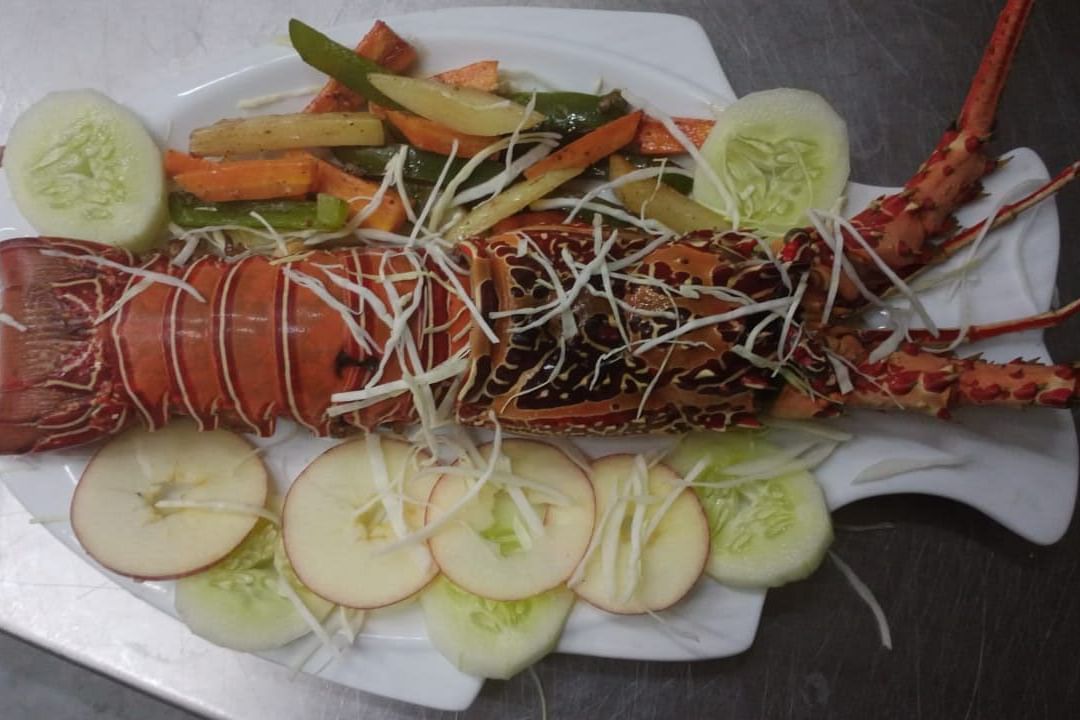 Lobster and vegetables on a plate | Matsya Island Retreat