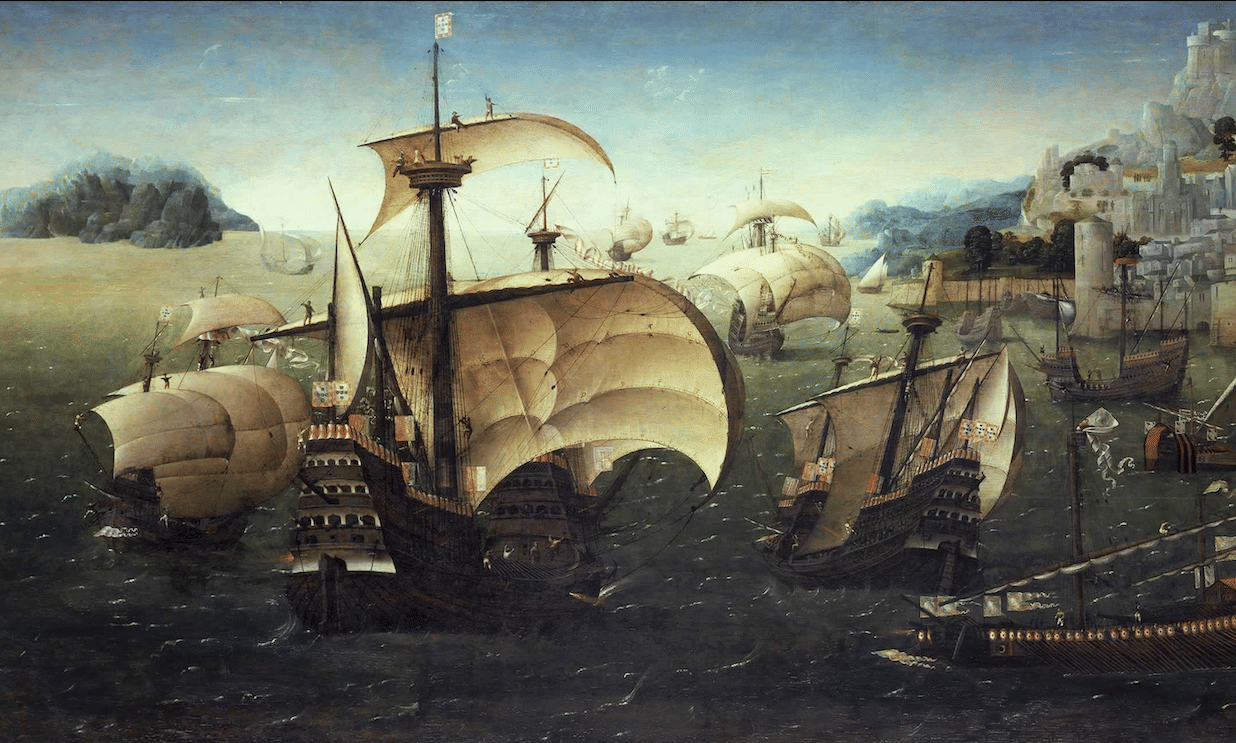 Portuguese carracks sailing near a rocky coast.