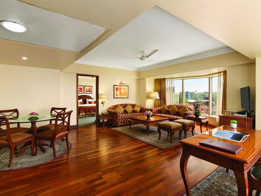 living room of the Deluxe Suite at Hotel Ramada Plaza Palm Grove Juhu Beach
