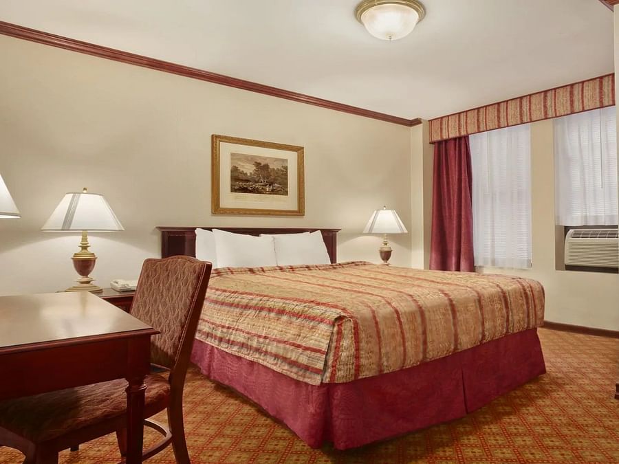 Large room with a bed and workdesk