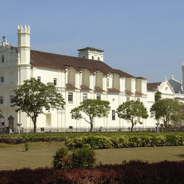 facade view of Saint Francisco church with trees and a garden in front of it