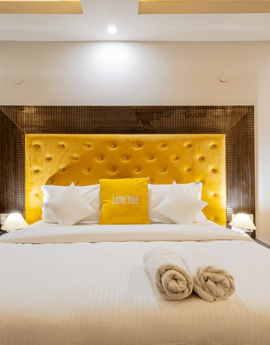King size bed in the superior double or twin room at Lime Tree Hotels and Banquet Hall Near Huda Metro, Gurgaon