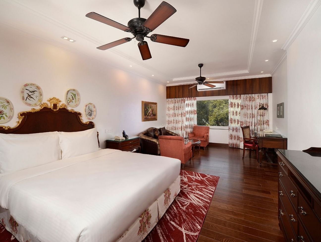 a king size bed facing the TV - Mayfair Himalayan Spa Resort Kalimpong