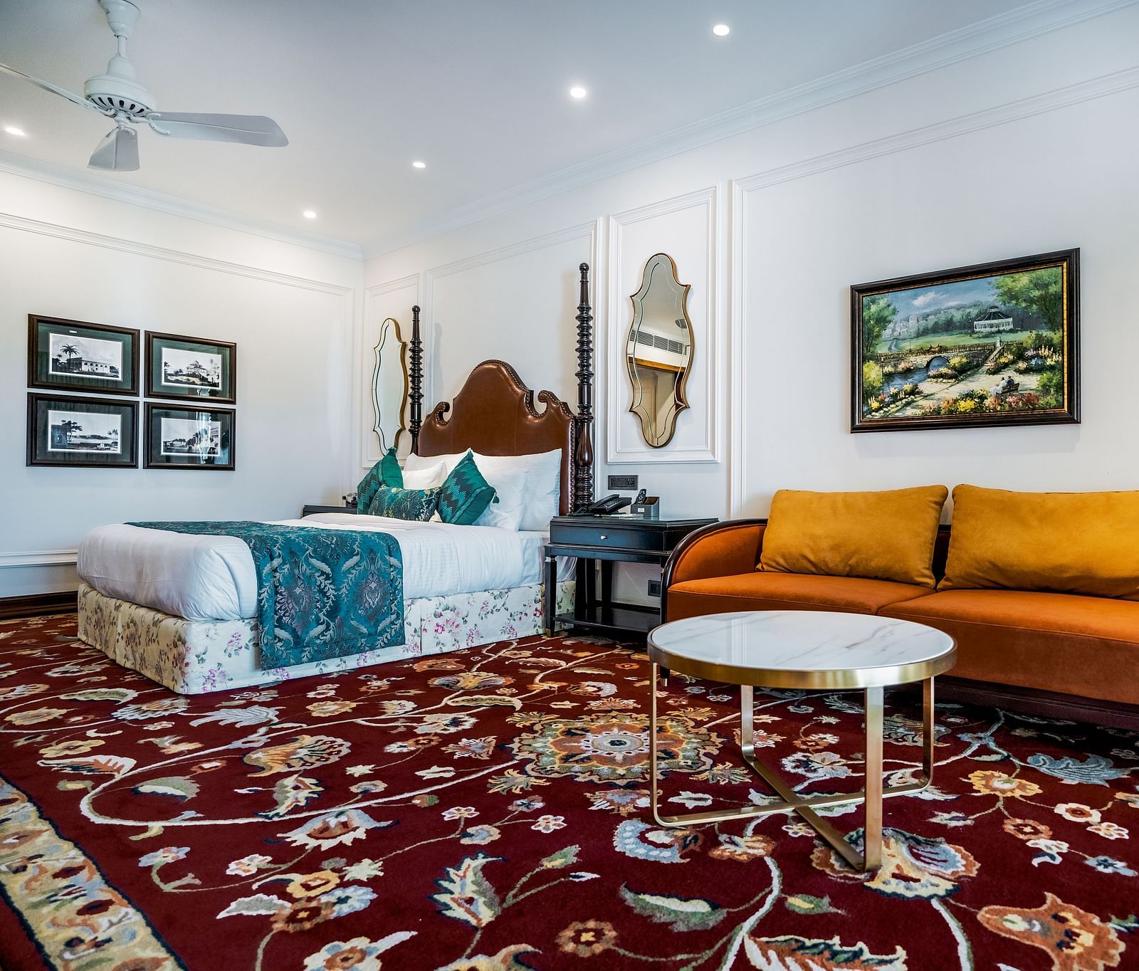 Contemporary room with twin beds, bright wall art, and cosy yellow couch