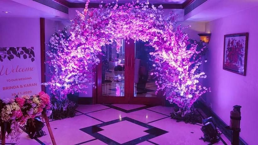 The entryway to the indoor wedding section features a stunning flower arch at The Orchid Hotel Mumbai Vile Parle