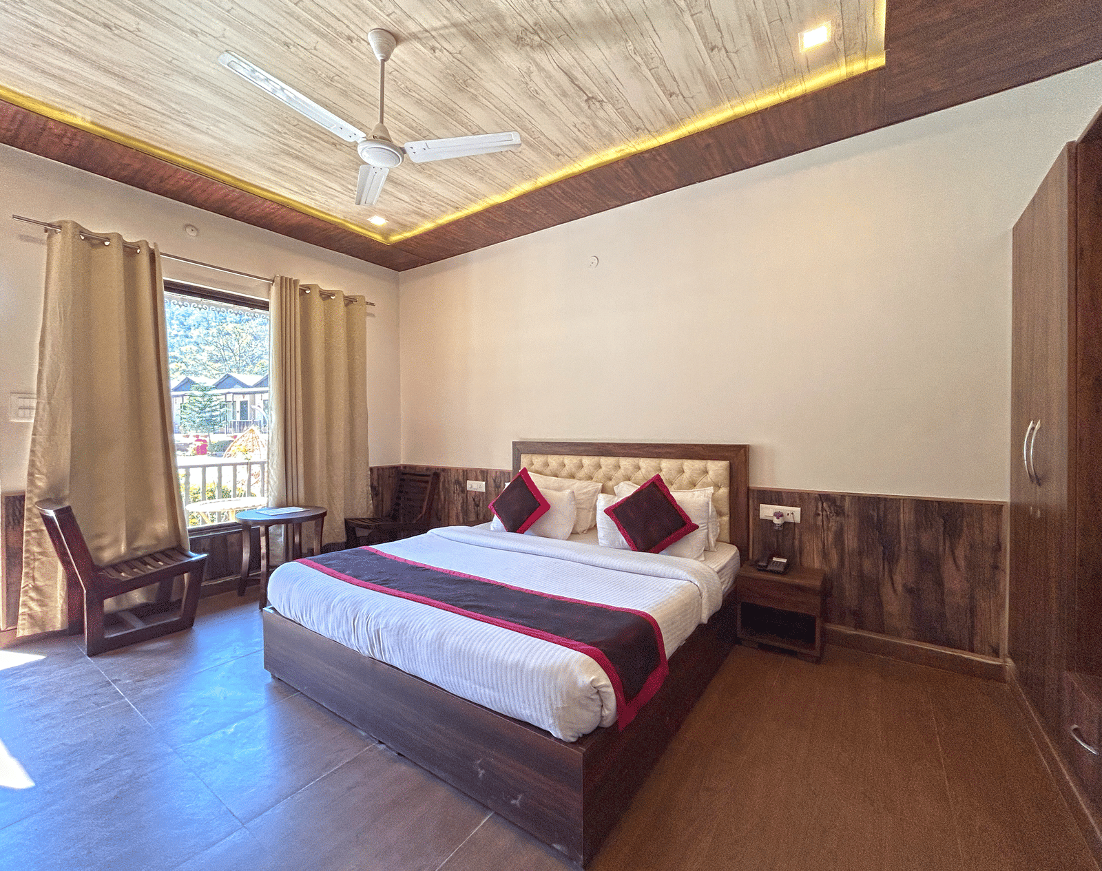 Luxury Cottage with a large bed at DLS MJ River Resort, Rishikesh.