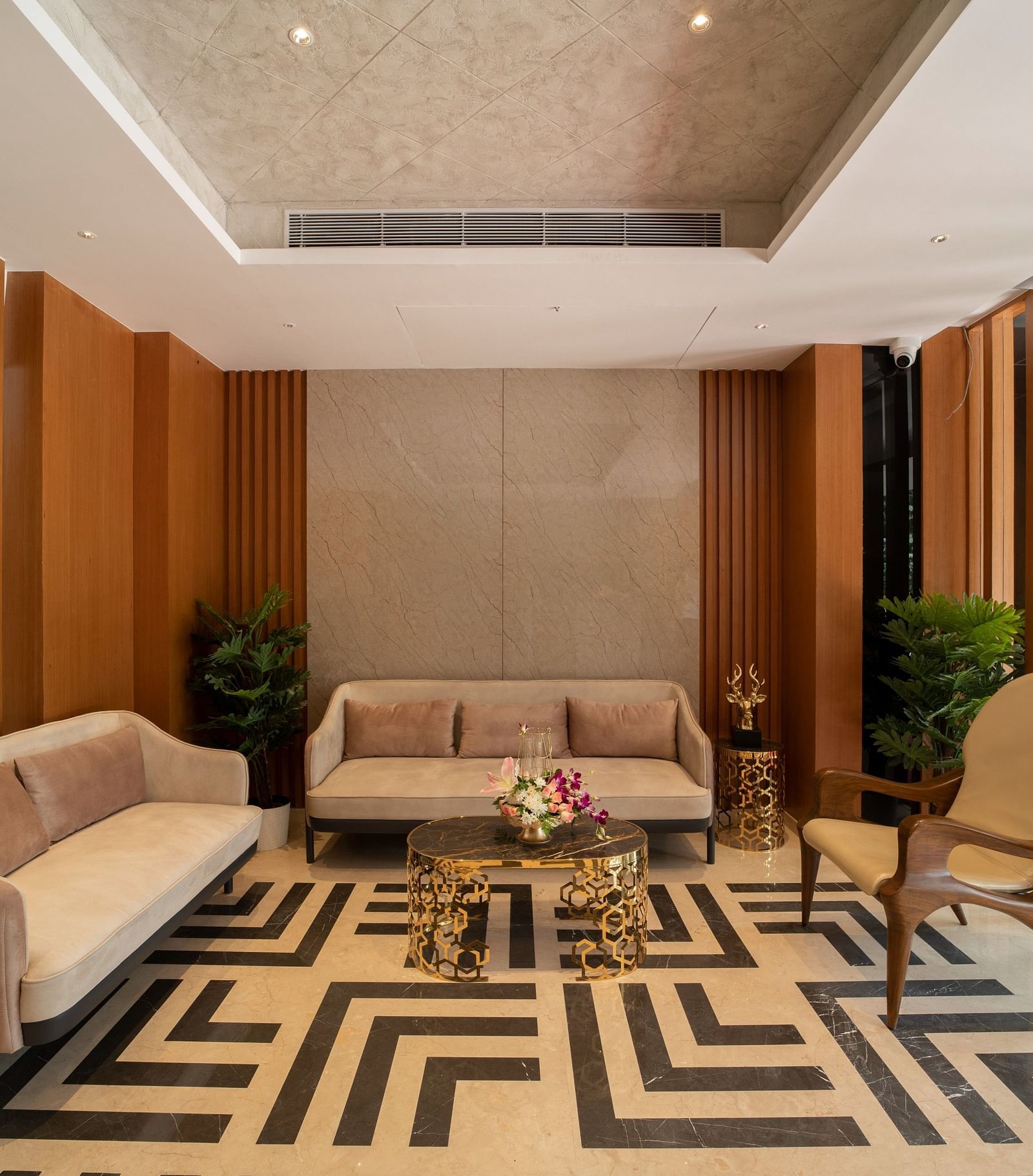 An image of a reception lobby featuring sofa sets, a centre table, and a chair - President Kumara Park