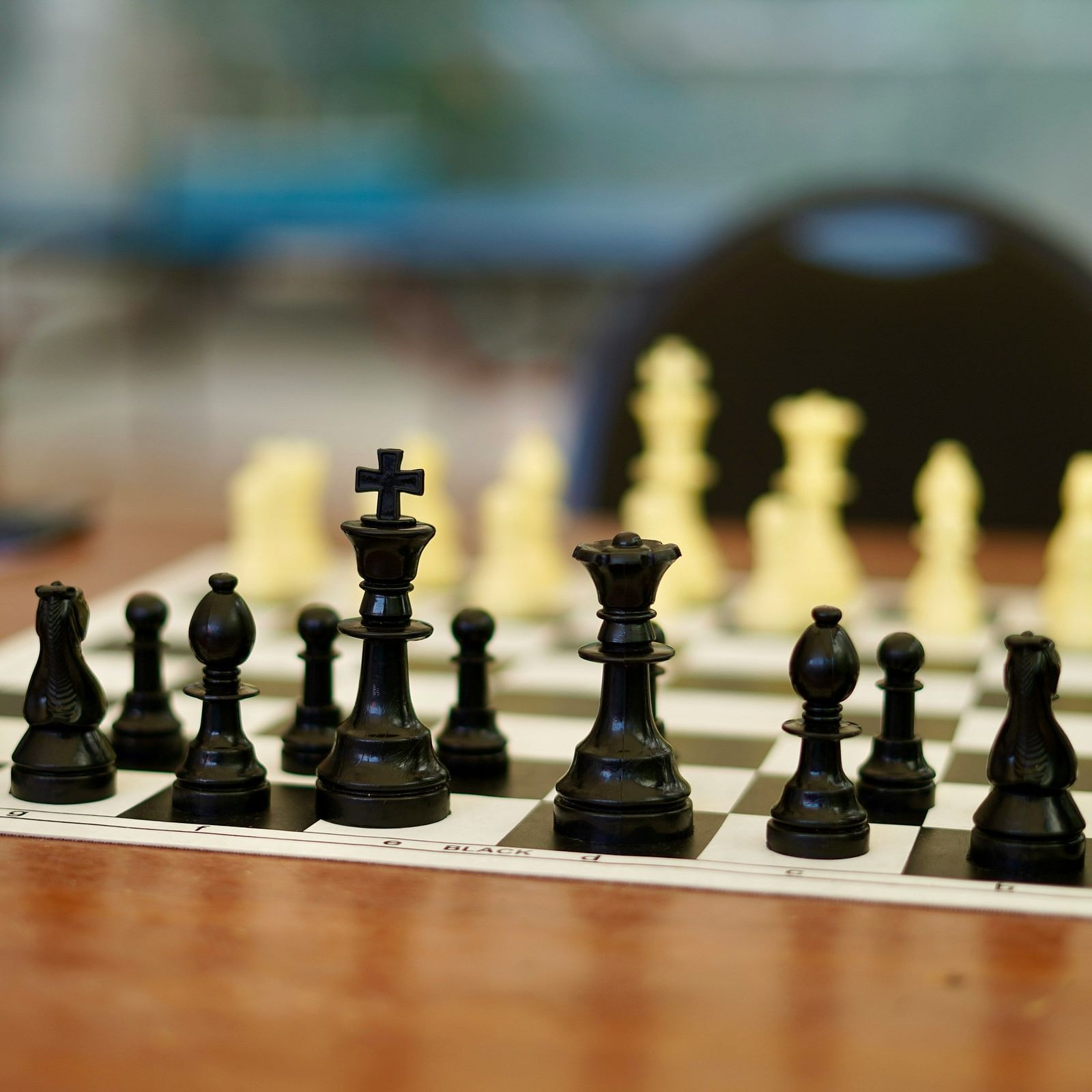 chess pieces on a wooden board