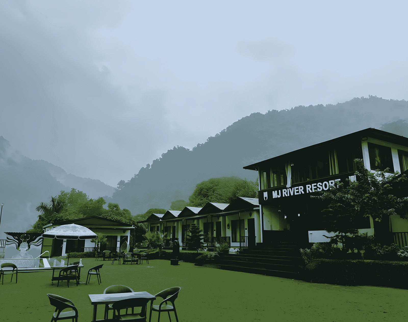 A side-view of DLS MJ River Resort, Rishikesh on a foggy day.