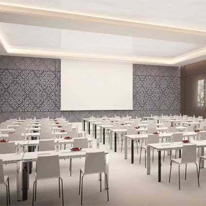 an event hall decked with rows of chairs at The Residency Towers Rameswaram