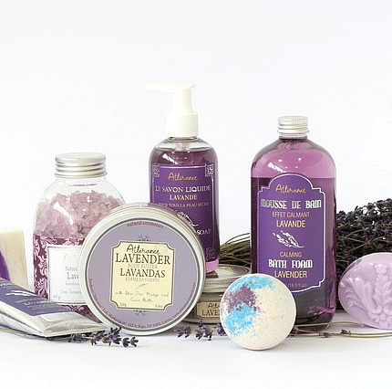 An image featuring a collection of lavender bath and body care products is displayed on blank surface. 