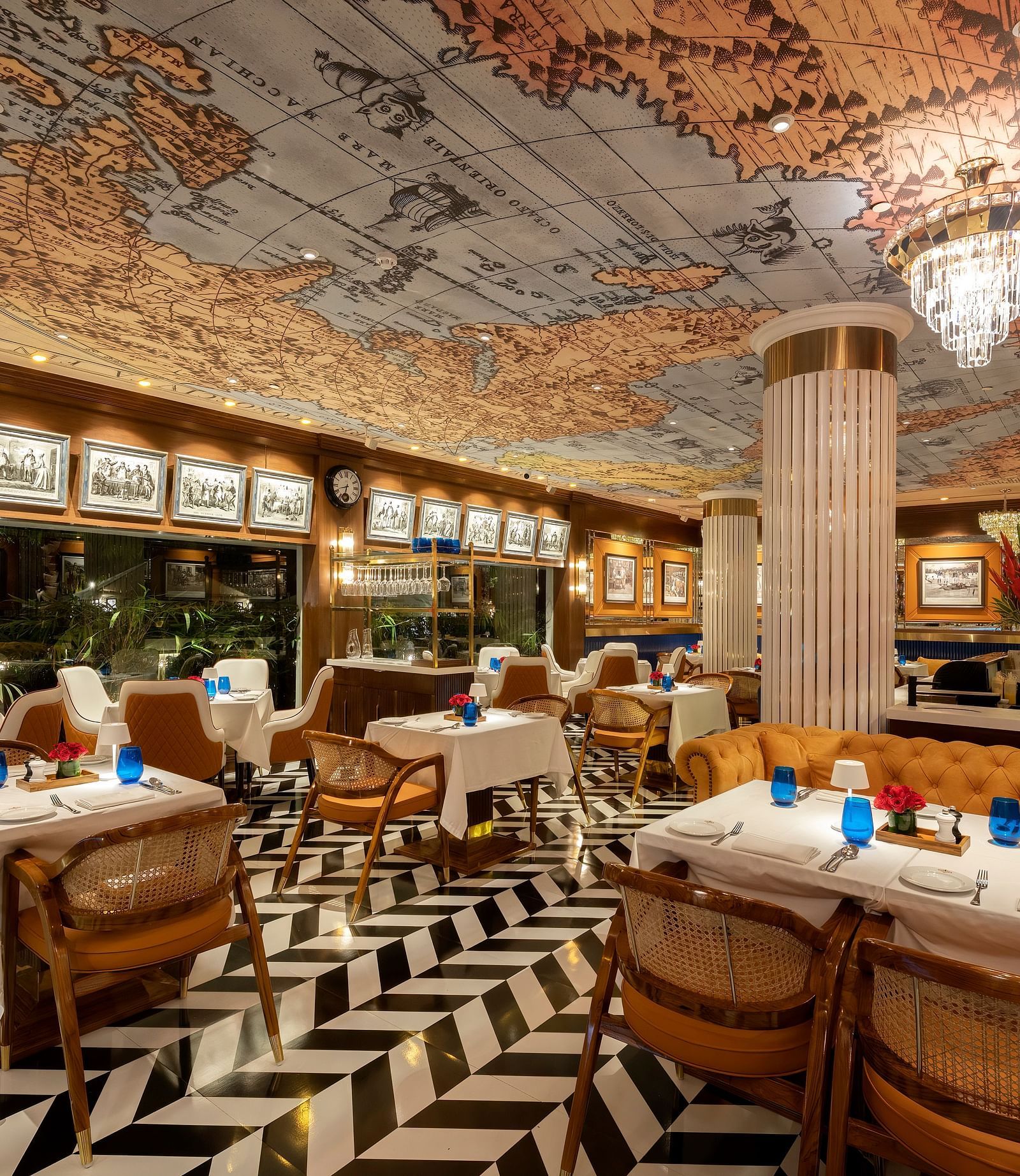 Pickwick dining space wih a map on the ceiling at The Claridges, New Delhi