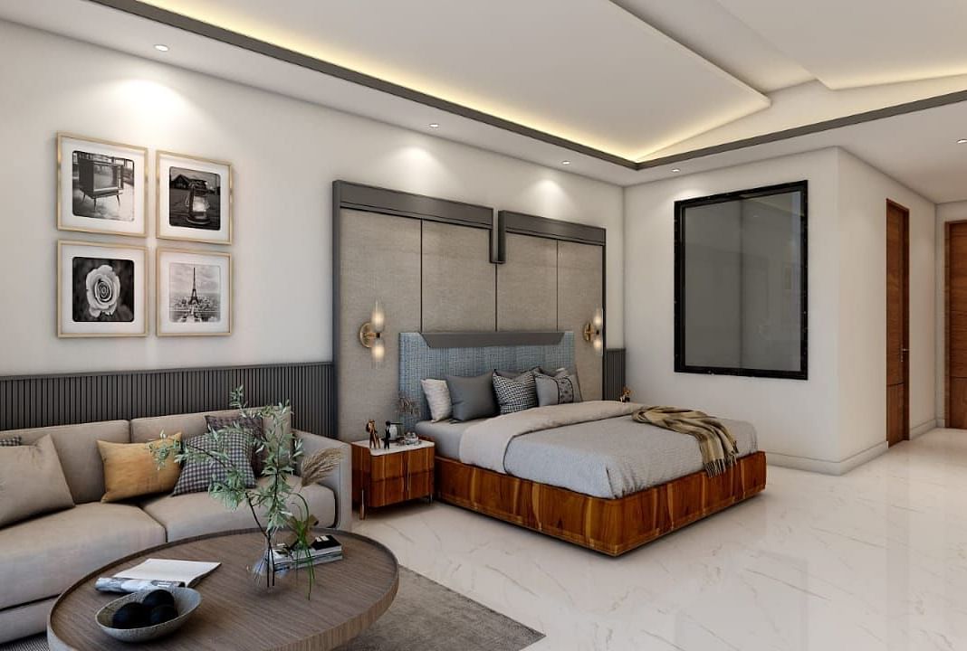 A spacious room featuring a double bed alongside a common seating area. - Namaste Corbett