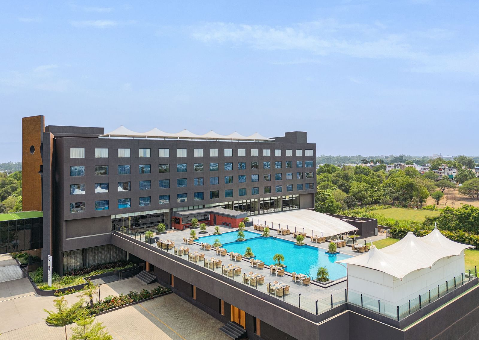 Exterior with the swimming pool in view of Essentia Luxury Hotel, Indore during the day