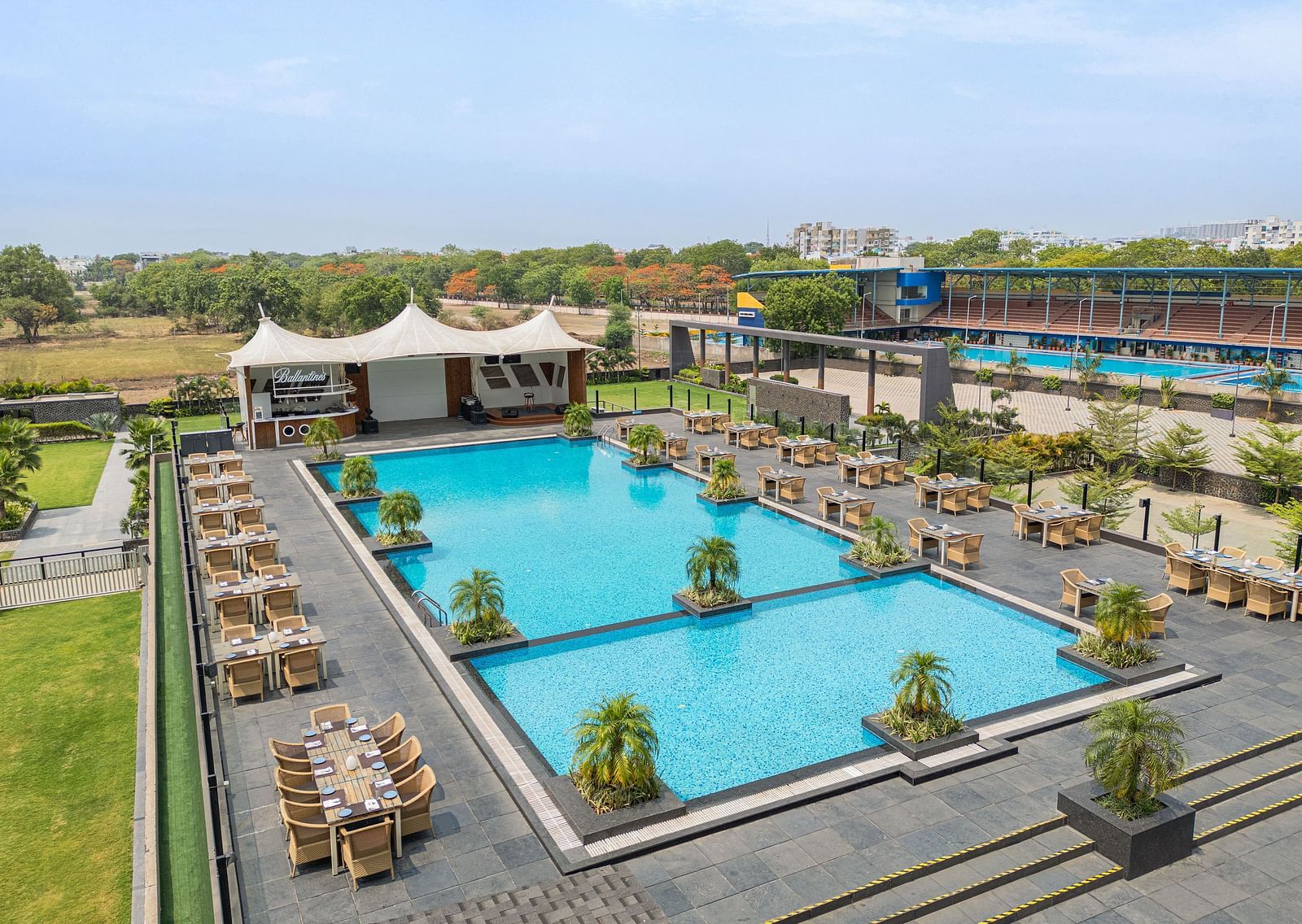 Aerial view of outdoor swimming pool at Essentia Luxury Hotel, Indore.