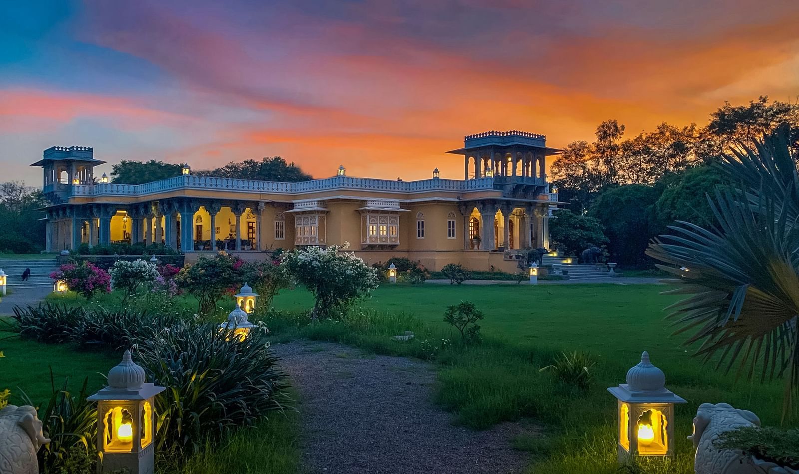 Facade image of Dev Shree, deogarh featuring a beutiful sunset in the background