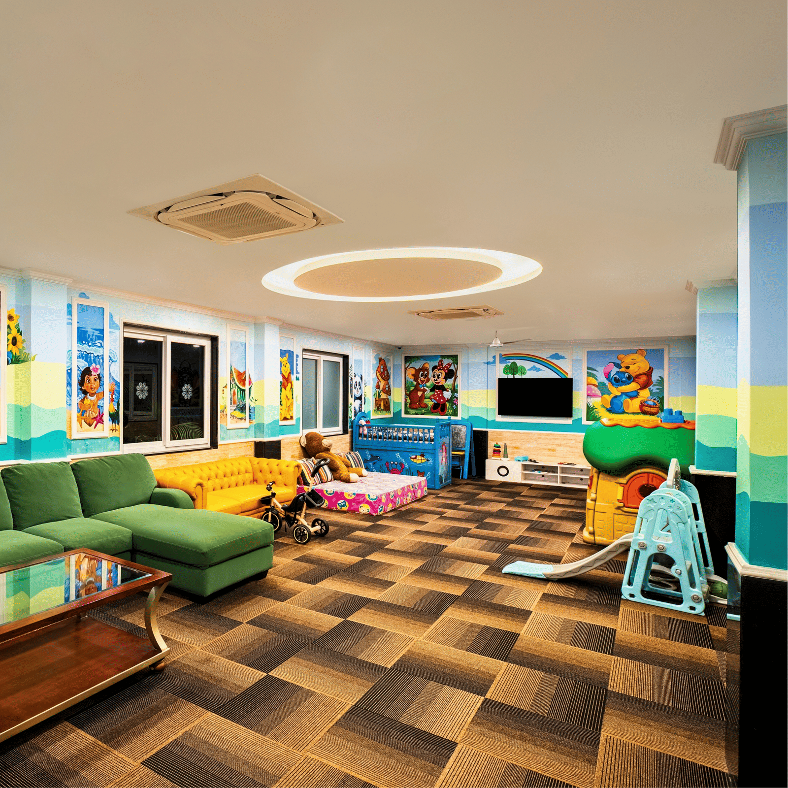 Kids game zone with cushioned seating, cartoon wall murals, a slide, a play house and toys at MAYFAIR Palm Beach Resort, Gopalpur-on-Sea.
