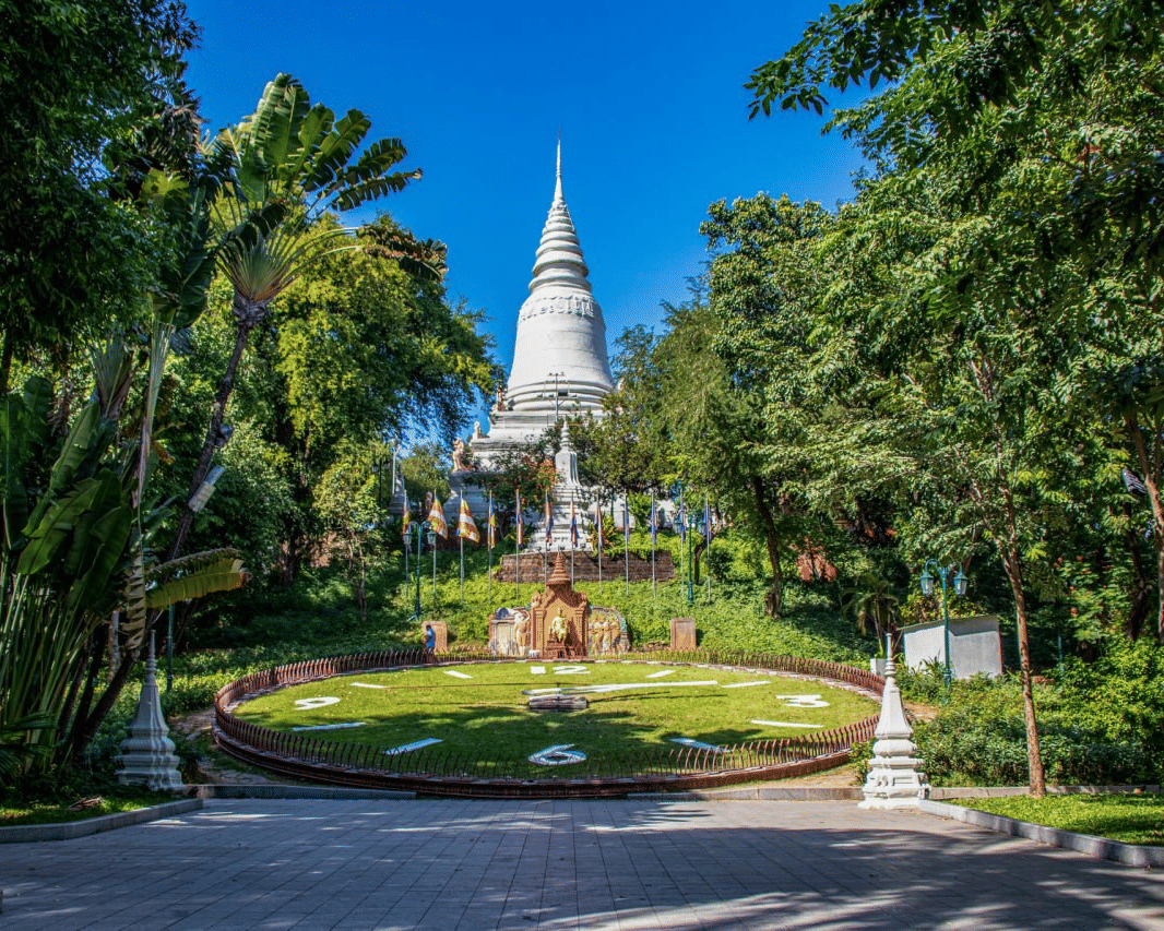 Iconic Wat Phnom temple and floral clock, a historic Buddhist landmark minutes from Central Mansions Phnom Penh.