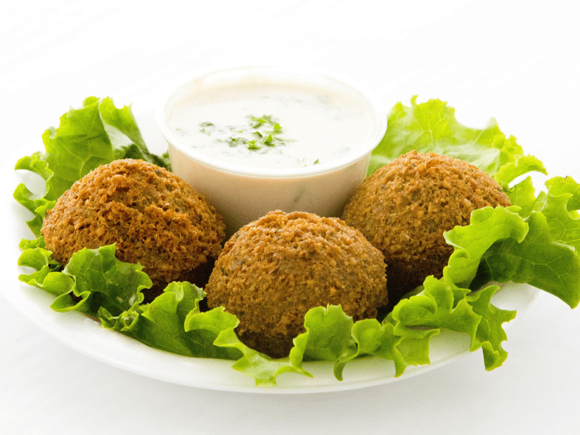 Falafel on a plate with mayo on the side