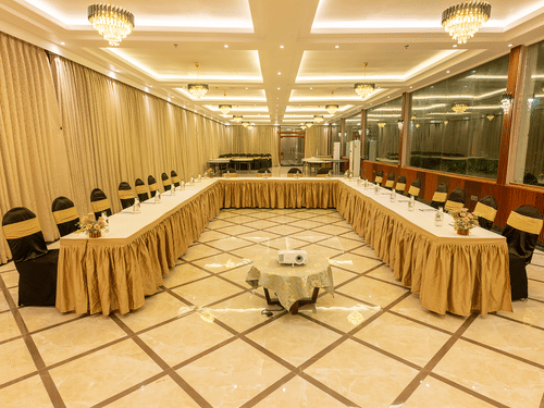 Conference hall with U-shaped table setup and draped decor at Silver Sand Sea Princess Beach Resort, Port Blair.