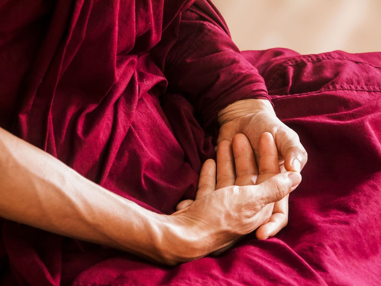 A monk meditating during the day