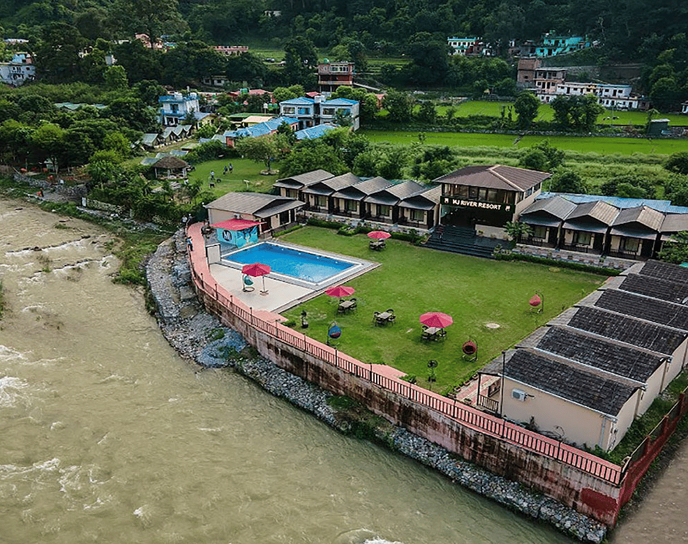 Aerial view of DLS MJ River Resort, Rishikesh during the day.