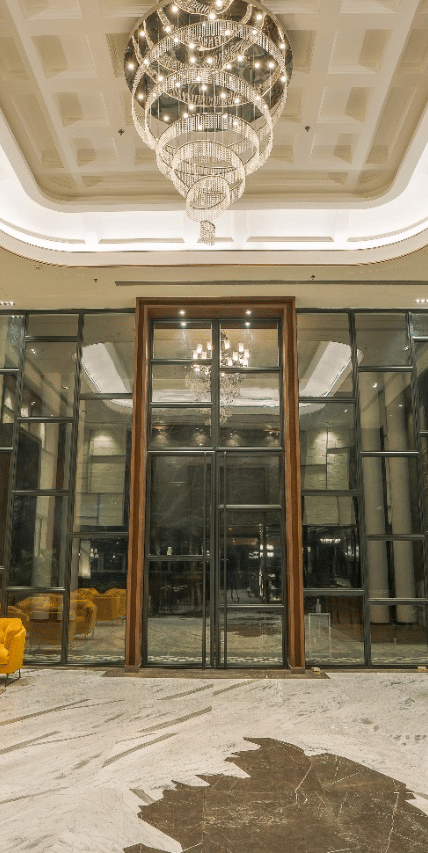 lobby-chandelier-yellow-chairs-reception