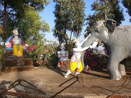 A colorful statue with a Nandi bull at the Nilkantheshwar Mandir.
