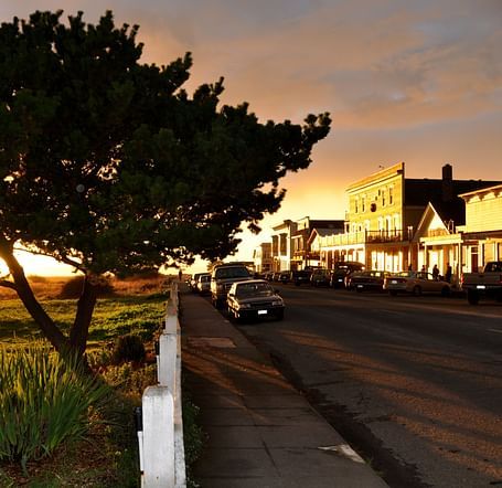 A sunset causing a postcard like image of a street in Mendocino - Brewery Gulch Inn & Spa