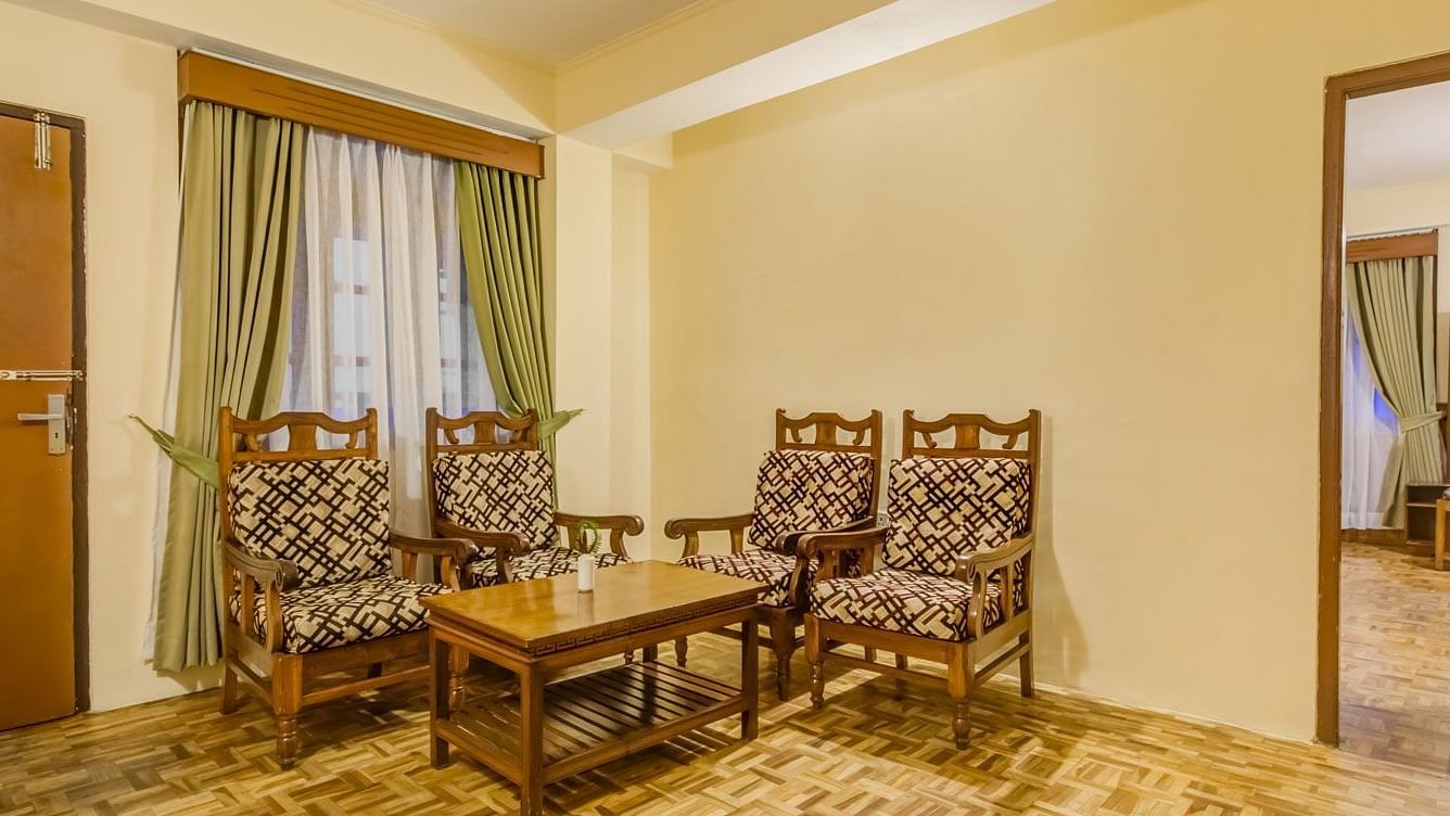 Image of a sitting area with chiars and a table at Summit Tashi Ghang Heritage Resort, Pelling