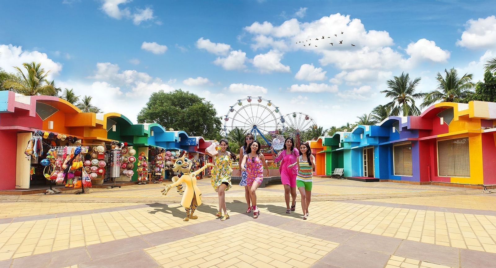 a group of people walking around MGM Dizzee World