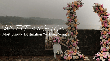 A promotional banner for a destination wedding at Fort Tiracol featuring floral arches, arrangements and the Arabian Sea overlooking the coastal setting.