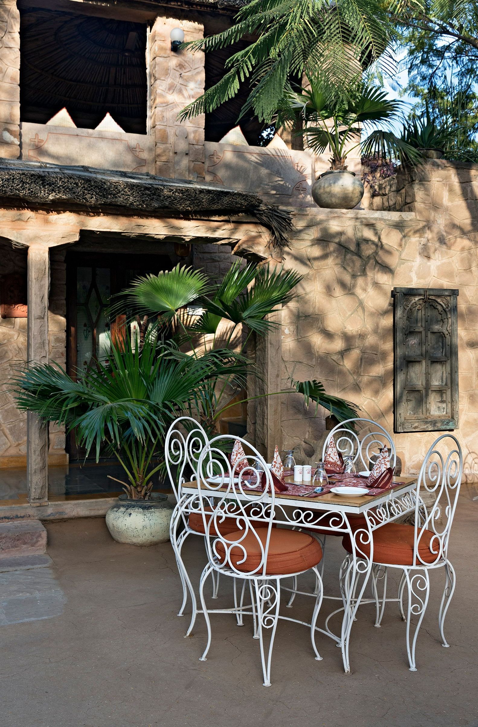 An image of the outdoor seating arrangement of the Taasli Restaurant at Manvar Shergarh - Manvar Resort & Desert Camp