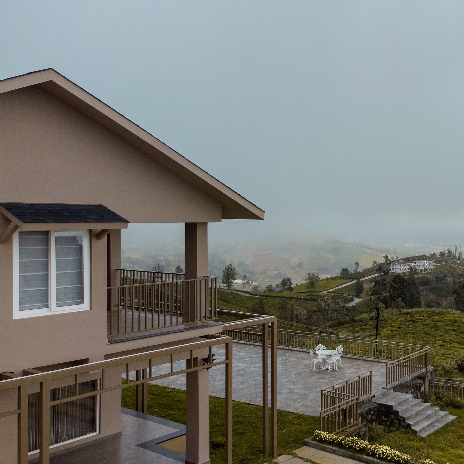 An image of an accommodation on a hill seen during a cloudy day