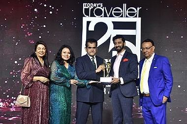 GRT Hotels receiving an award at an event.