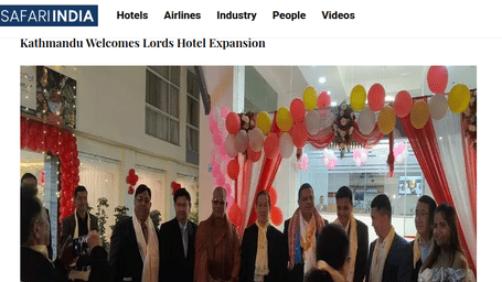  Inauguration event for Lords Hotel in Kathmandu, Nepal. A group of dignitaries stand together outside the hotel entrance decorated with red and white balloons.