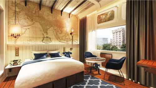 Spacious bedroom with dual beds and map-themed wall art - polo floatel kolkata