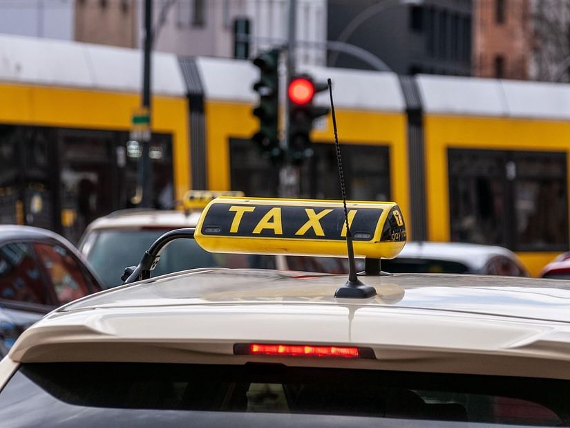 A top portion of a car showing the sign reading taxi 