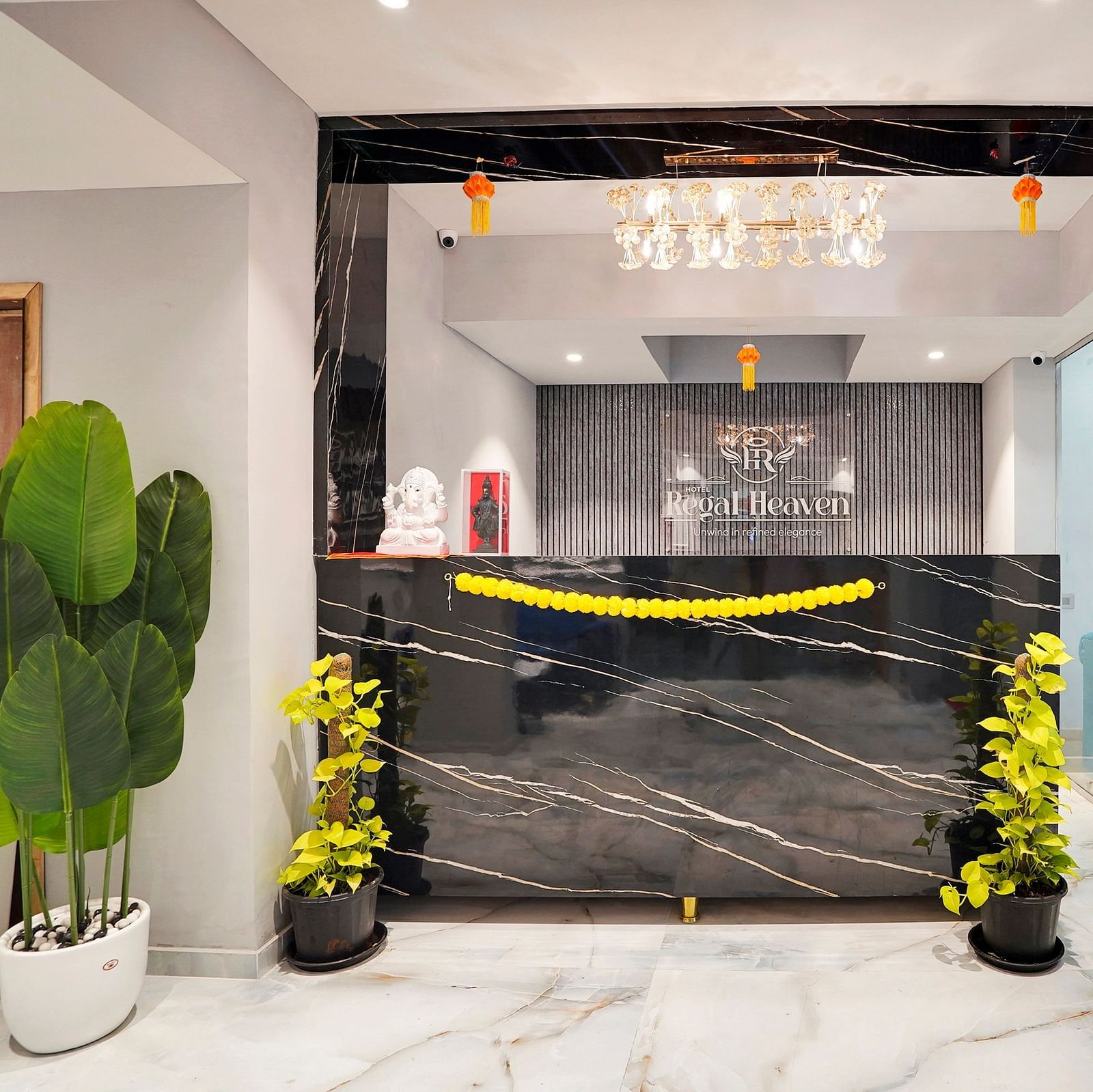 Reception desk in the lobby at Hotel Regal Heaven, Pune.