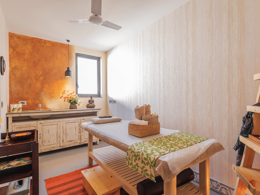 A spa room featuring all the necessary items required for a session or treatment - Karma Lakelands.