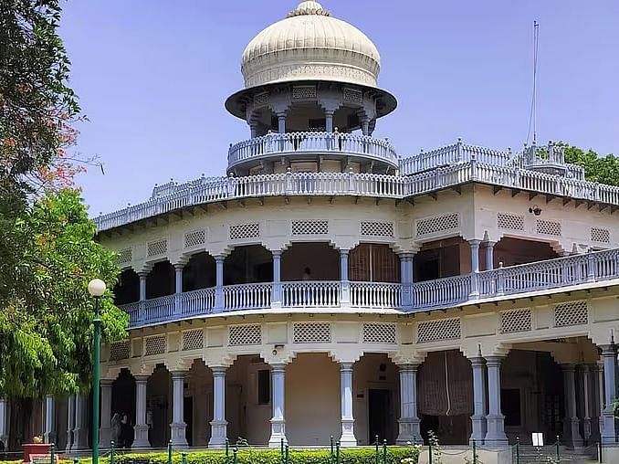 A grand building with a large dome and intricate architectural details.